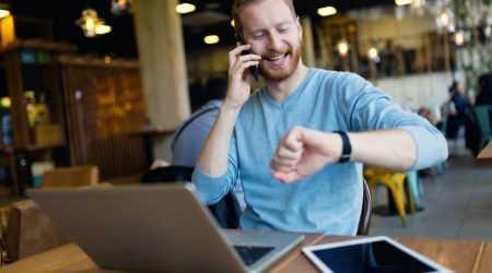 young-man-having-phone-call-in-coffee-shop.jpg